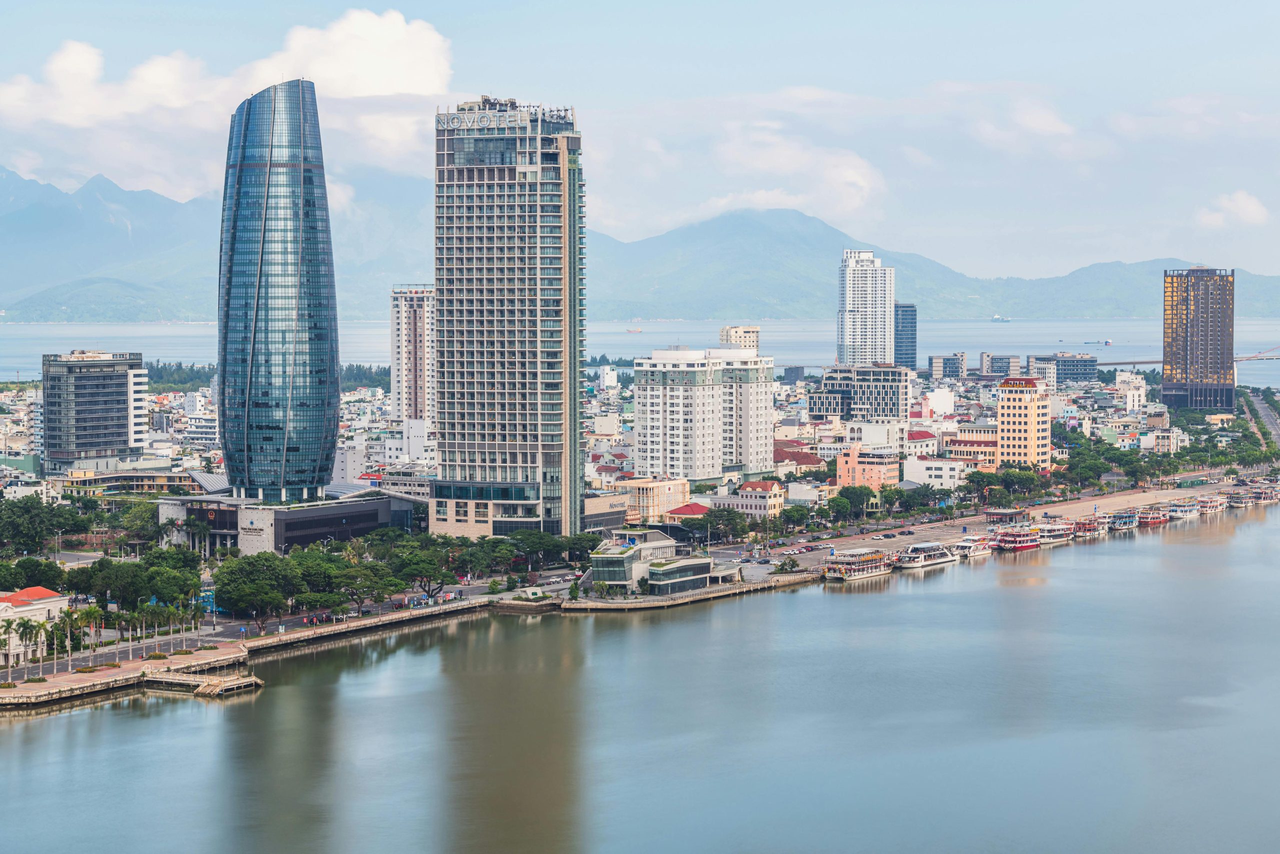 Stunning aerial view of Da Nang skyline with skyscrapers by the river. Perfect for travel and urban stock photos.
